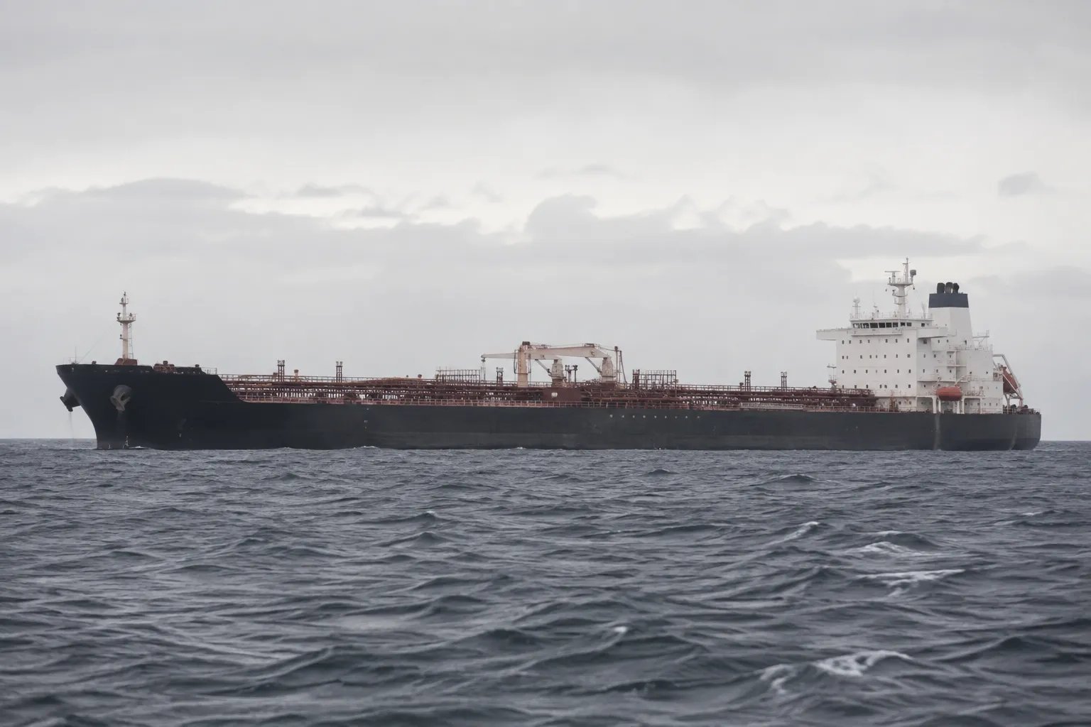 Tanker vessel chartering and port agency coordination